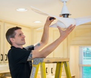 Miller & Miller Electrician installing ceiling fan